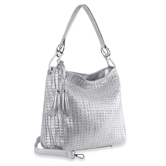 The Rhinestone Accented Pleated Hobo Handbag features a shiny silver faux leather finish with a textured grid pattern, top handle, adjustable shoulder strap, and decorative side tassels.
