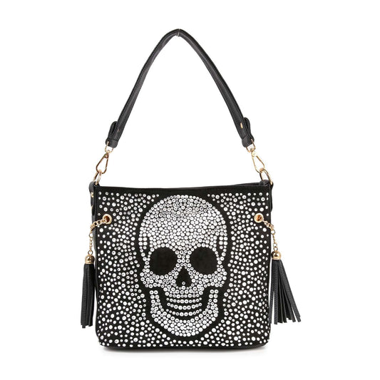 The Sparkling Jolly Skull Hobo Crossbody is a black faux leather bag with a large white rhinestone skull, stud accents, gold hardware, and black tassels on each handle side.