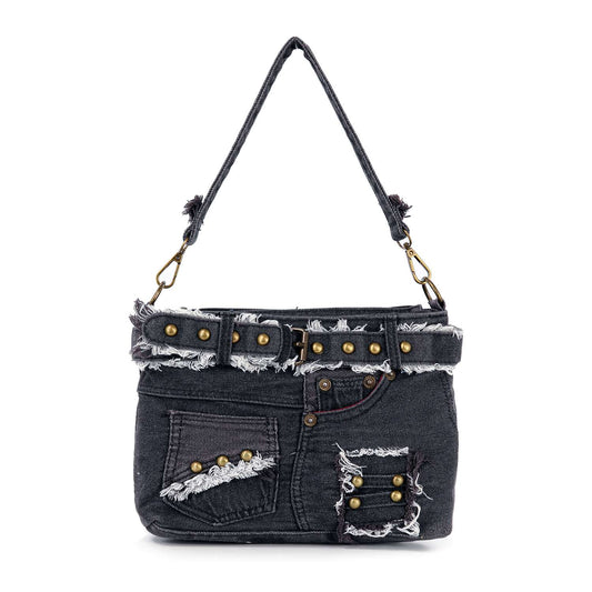 The Belted Denim Hobo Handbag is styled like distressed black jeans, featuring a belt, frayed edges, pockets, metal rivets, a matching denim strap, and brass hardware.