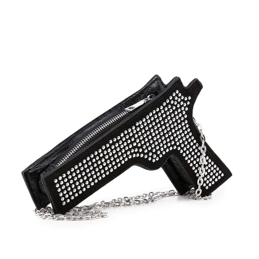 The Rhinestone Pistol Design Evening Bag is a black, handgun-shaped evening bag adorned with rows of silver studs, featuring a top zipper and a silver chain strap.