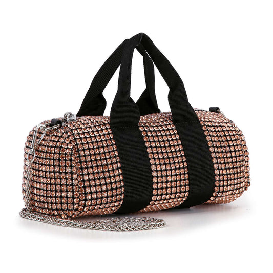 The Classy and Casual Rhinestone Evening Bag is a small cylindrical tote, covered in gold rhinestones with black handles, vertical black straps, and a sleek silver chain shoulder strap.