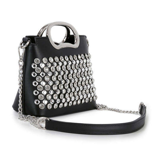 The Studded Stone Shoulder Bag Tote is a black faux leather handbag with silver circular studs, a metallic silver handle, and a detachable chain strap with a leather shoulder pad.