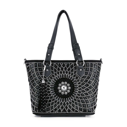 The Patterned Bling Layered Design Shopper Tote is a black faux leather tote with dual handles, white and silver studded circular designs, a central floral motif, a black tassel accent, and tablet compatibility for stylish functionality.