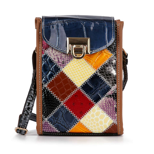 The Genuine Leather Colorful Petite Crossbody Sling features a patchwork design in navy, yellow, red, white, purple, and brown squares with a shiny blue flap, brown trim, gold clasp and hardware. Includes an adjustable strap for versatile wear.