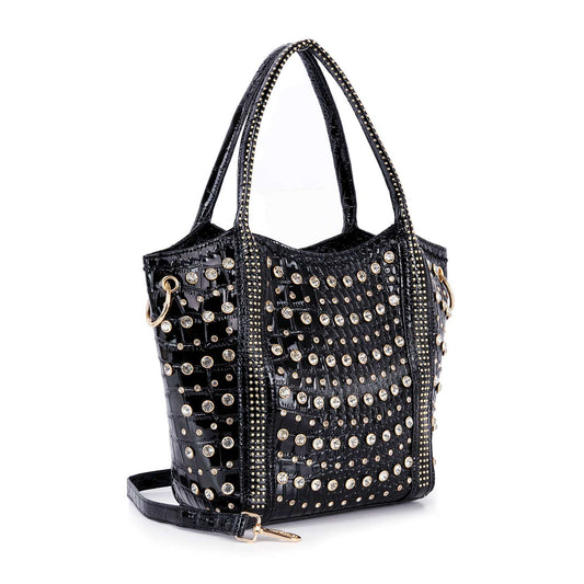 The Studded Rhinestone Alligator Embossed Tote Handbag features a black alligator texture, gold and silver studs, dual handles, a detachable shoulder strap, and decorative side zippers.