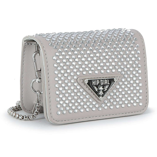 The Petite Dazzling Front Flap Shoulder Bag Clutch is a compact light gray faux leather handbag with rows of shiny silver studs, a black and silver triangular HIP GIRL logo on the front, and a silver chain strap—perfect for evenings.