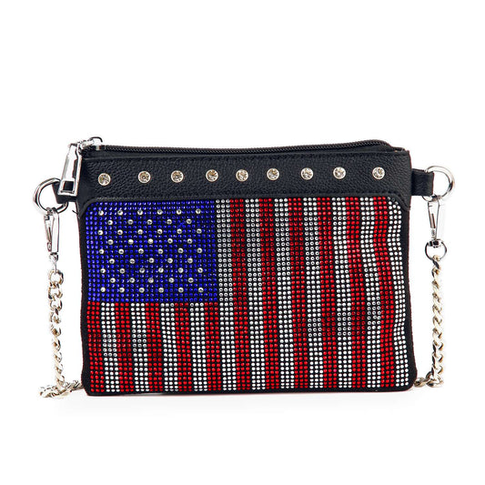 The Rhinestone Flag Crossbody Sling is a small black faux leather bag with a silver chain strap, featuring red and white stripes and a blue rhinestone star field in an American flag design.