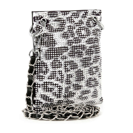 The Rhinestone Bling Petite Crossbody Sling features a silver and black leopard print, thick silver chain strap, metal grommets, and a sparkling faux leather finish.
