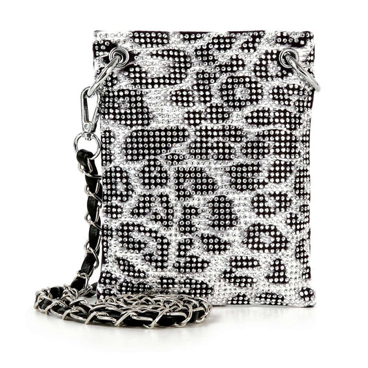The Rhinestone Bling Petite Crossbody Sling features a black and silver leopard print with sparkling rhinestones, silver grommets, and a chain strap interwoven with black for chic, standout style.