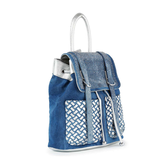 The Rhinestone Basketweave Drawstring Backpack is a stylish blue bag with silver hardware, a flap with silver studs, two front pockets in a white and silver basketweave pattern, and a secure drawstring closure.