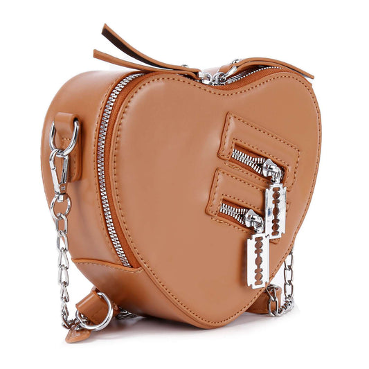 The Modern Heart Petite Shoulder Bag is a tan faux leather heart-shaped handbag with a silver chain strap, dual front zipper pockets, and decorative zipper pulls.