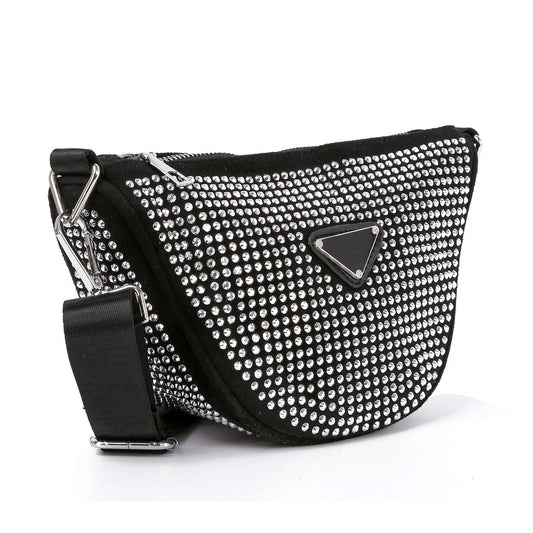 The Sparkling Rhinestone Crossbody Sling is a black gemstone-inspired bag adorned with small, shiny rhinestones, featuring a wide adjustable strap and a front silver triangular logo plate.