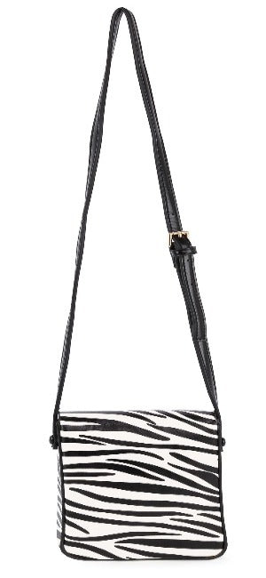 The Classic Front Flap Cell Phone Crossbody Bag features a black adjustable strap, bold black-and-white zebra print front, and gold-toned hardware for an elegant touch.