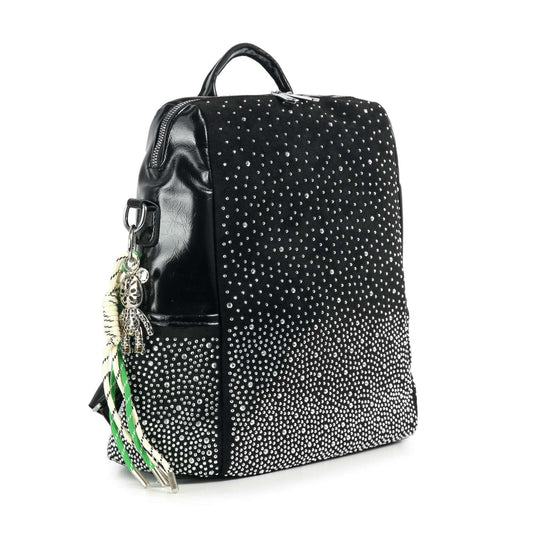 The Glamorous Stone Design Fashion Backpack is a black faux leather bag with small silver studs in a gradient pattern, a top handle, black accents, and keychains with ribbons and a silver figure on one side.