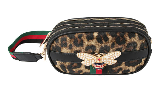 The Rhinestone Bee Leopard Print Crossbody Bag features faux leather, a leopard print, green-and-red adjustable strap, gold zippers, and a jeweled bee brooch on the front.