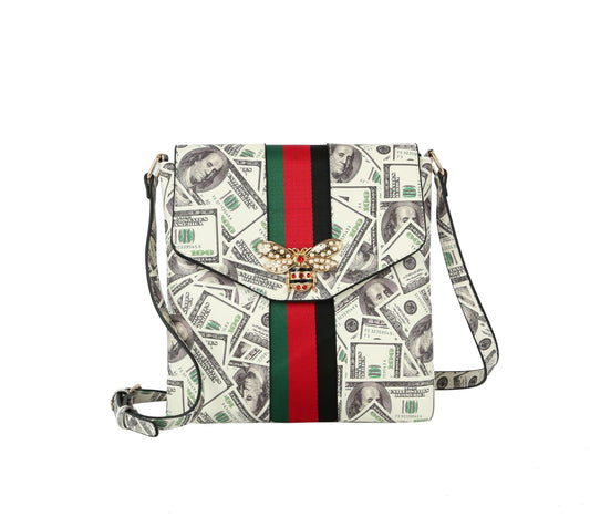 The Rhinestone Bee Striped Crossbody Sling features faux leather printed with hundred-dollar bills, gold hardware, a red and green stripe, and a rhinestone bee accent on the front flap.