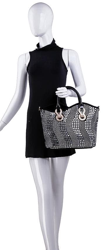 A mannequin in a sleeveless black dress holds the Rhinestone Wave Design Elegant Tote Handbag with black handles and an eye-catching black-and-white pattern in its right hand.