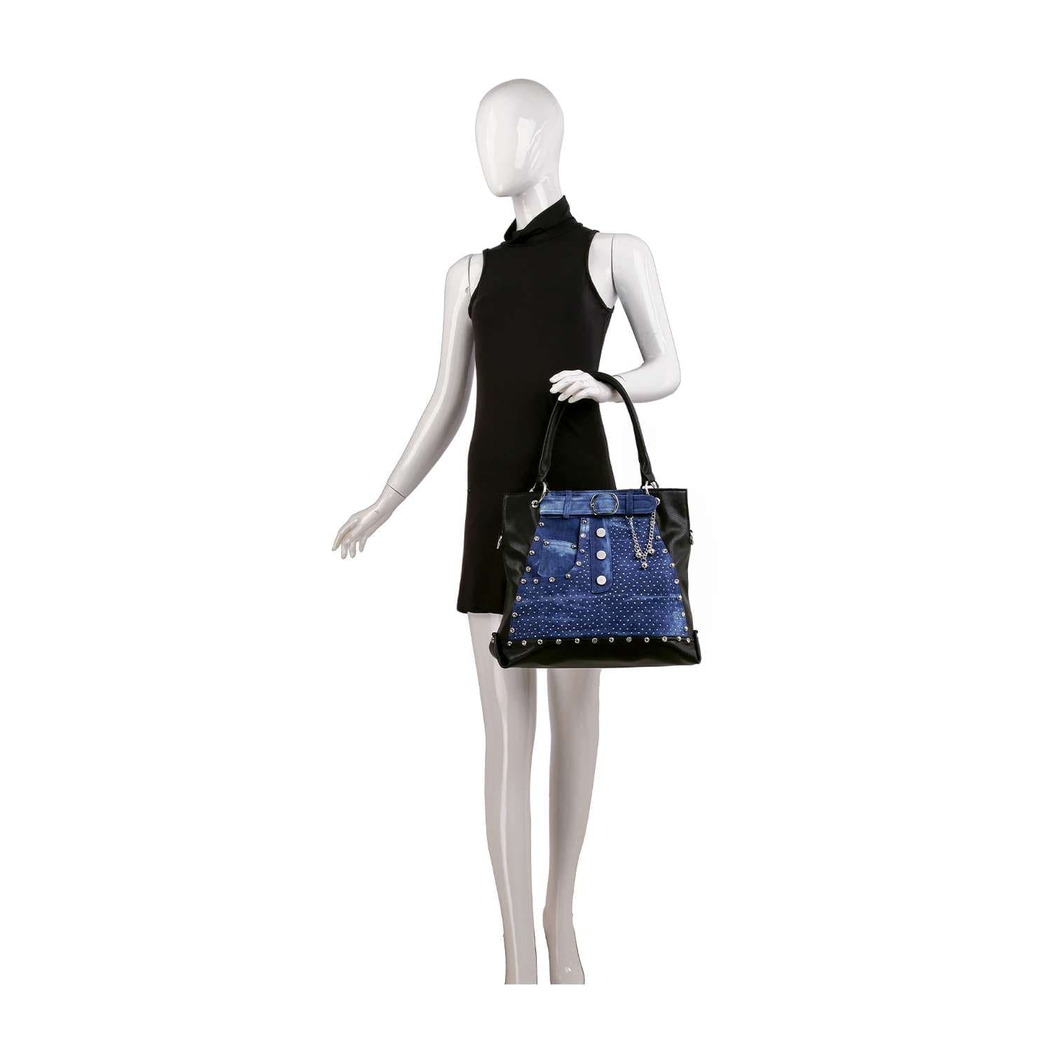 A mannequin in a sleeveless black dress holds the Belted Jean Design Tote Handbag, a spacious tote with button details, displayed against a white background.