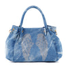 The Sparkling Wing Design Fashion Handbag is a blue denim tote with double handles, silver rhinestone angel wings, scattered rhinestones, gold side hardware, and a soft, slouchy shape.