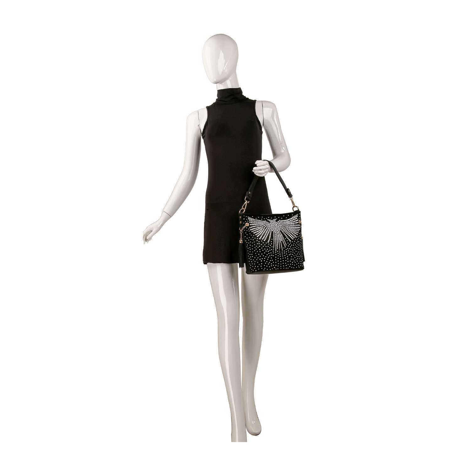 A mannequin in a sleeveless black mini dress holds the Stunning Wing Design Hobo Crossbody featuring a white sunburst pattern and gold hardware. The faux leather bag pops against the plain white background.