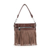 The Classic Fringe Convertible Crossbody is a brown leather bag with a top handle, front zipper pocket, and long fringe with small silver studs hanging from the bottom.