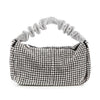 The Ruched Sparkling Stone Fashion Bag is a petite faux leather handbag, featuring sparkling silver rhinestones and a textured ruched handle, displayed against a white background.
