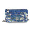 The Multi Compartment Petite Crossbody Bag is a blue denim bag adorned with silver rhinestones, featuring zipper closure, silver hardware, multiple compartments, and a stylish chain strap.