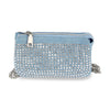 The Multi Compartment Petite Crossbody Bag is a small light blue denim bag featuring silver rhinestones on the front, a silver zipper closure, and shiny silver hardware on its chain strap.