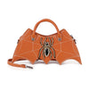 The Bat Wing Rhinestone Spider Accent Fashion Bag is a brown faux leather handbag shaped like bat wings, with white stitched web details, a rhinestone spider accent, handle, and shoulder strap for a bold, stylish look.
