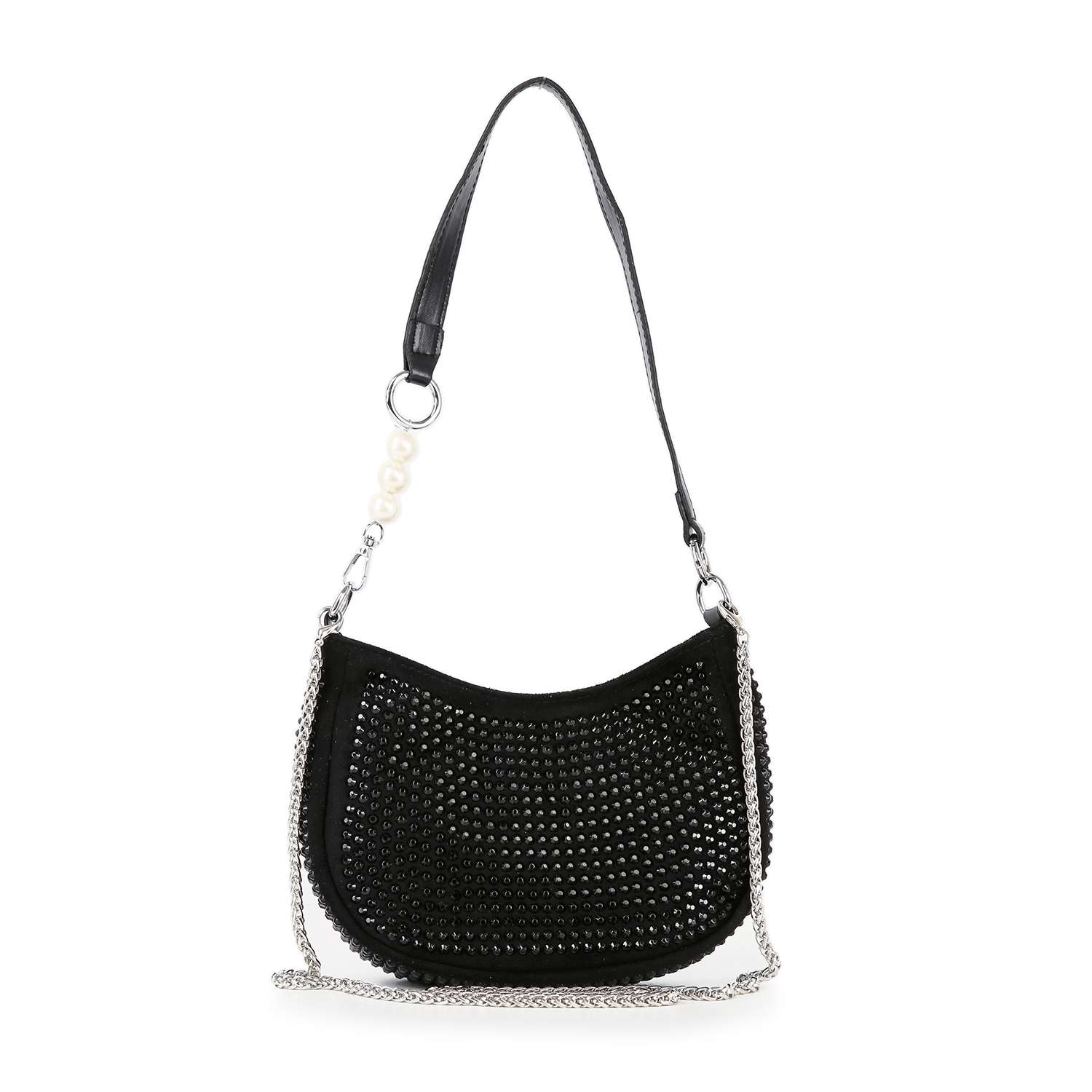 The Rhinestone Accented Petite Shoulder Bag is a black faux leather bag with a curved silhouette, silver stud details on the front, a black strap with pearl accents on one side, and a detachable chain strap attached to both sides.