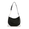The Rhinestone Accented Petite Shoulder Bag is a black faux leather bag with a curved silhouette, silver stud details on the front, a black strap with pearl accents on one side, and a detachable chain strap attached to both sides.