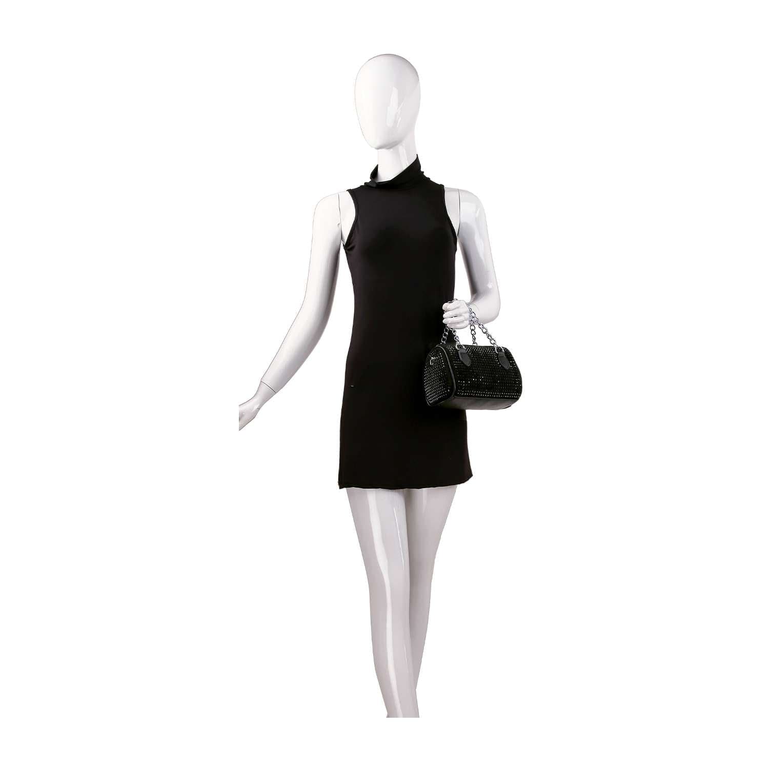 A mannequin in a sleeveless, short black dress holds a Chain Handle Rhinestone Evening Bag with silver hardware against a plain white background.