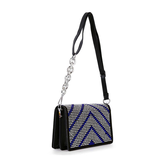 The Ultra Petite Sparkling Shoulder Bag features a black design with a wide faux leather strap, silver chain detail, and a front flap adorned with silver and blue rhinestones in a chevron pattern.