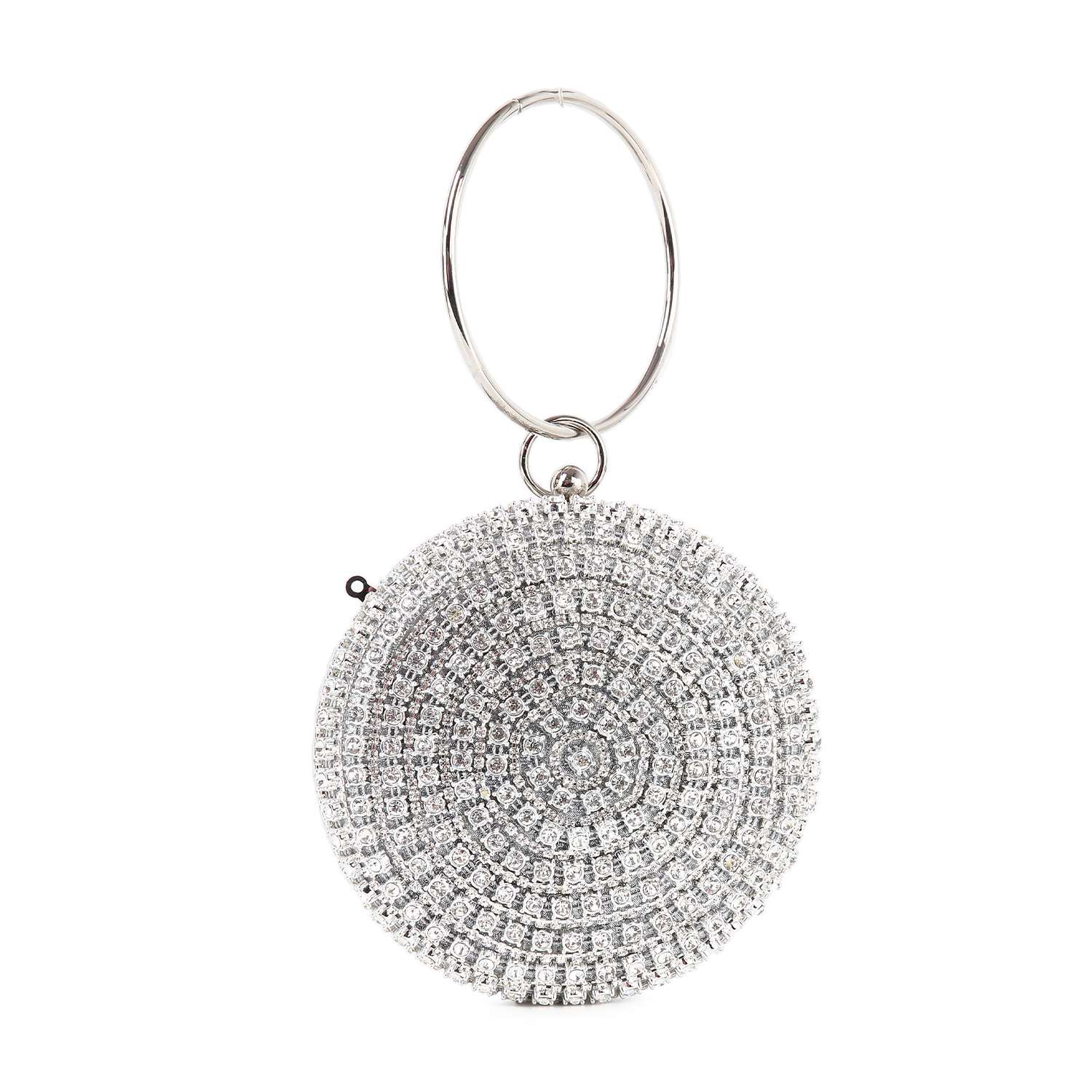 The Circular Rhinestone Evening Bag is a round, silver evening bag adorned with sparkling rhinestones in a circular pattern and a large metal ring handle—perfect as a dazzling wristlet for any night out.