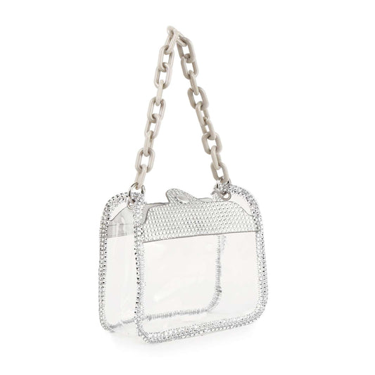 The Rhinestone Trimmed Clear Stadium Approved Shoulder Bag features a rectangular shape, glittery silver rhinestone trim, chunky off-white chain handle, and a textured lips-shaped silver clasp—perfect for your next event.
