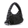 The Petite Decorative Trim Shoulder Bag is a black faux leather handbag with a thick braided handle, textured studded front, rounded shape, detachable shoulder strap, and silver-toned hardware.