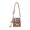 The Decorative Accent Shoulder Bag is a small, lightweight brown crossbody with an adjustable strap, a colorful geometric tapestry flap in blue, white, red, and yellow, and a plush bunny keychain on the side.
