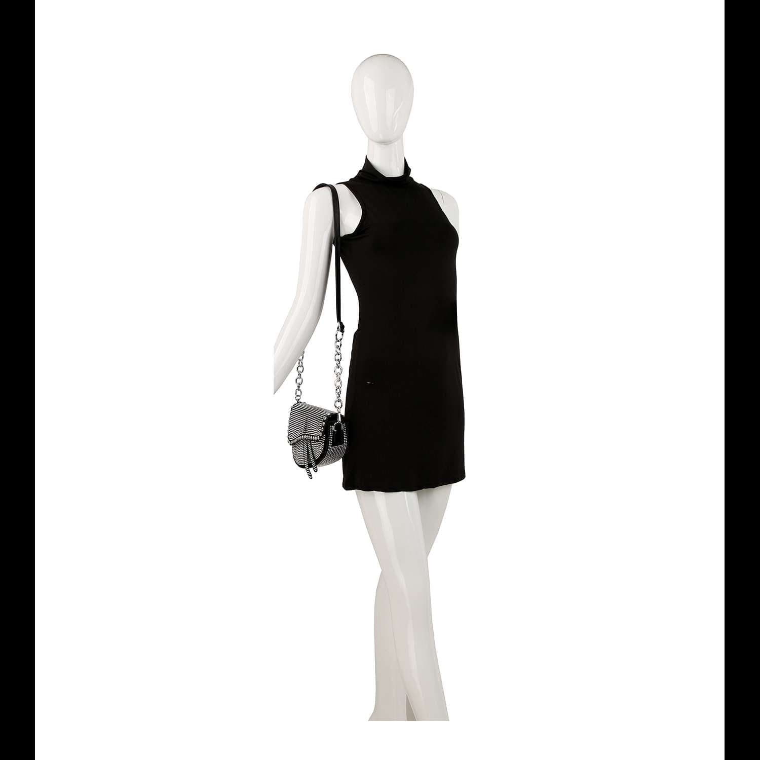 A white mannequin holds the Chain Handle Petite Shoulder Bag while wearing a sleeveless black mini dress, posed against a plain white background.