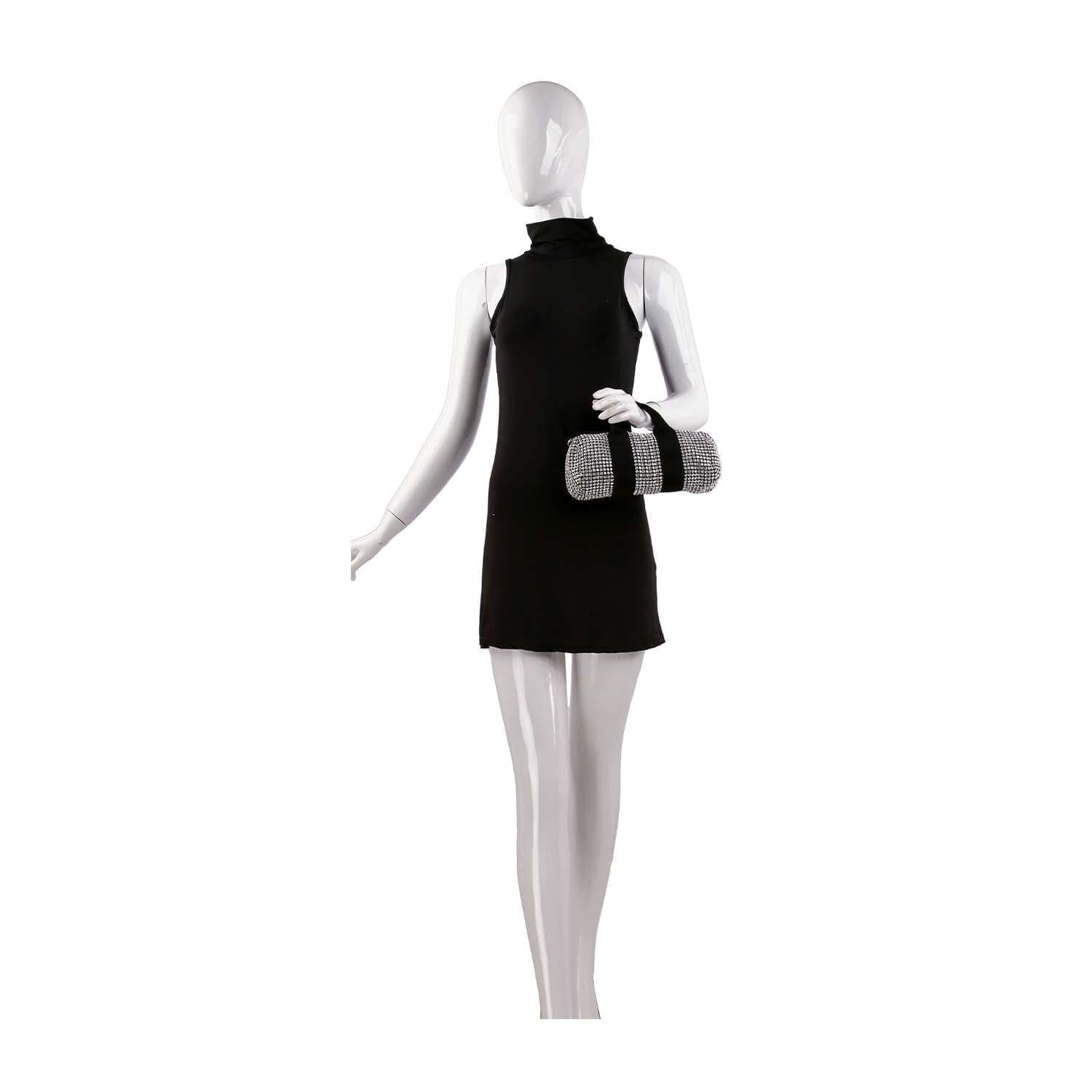 A mannequin in a sleeveless black mini dress holds the Classy and Casual Rhinestone Evening Bag, a small cylindrical purse with a silver-and-black chain strap, standing against a plain white background.