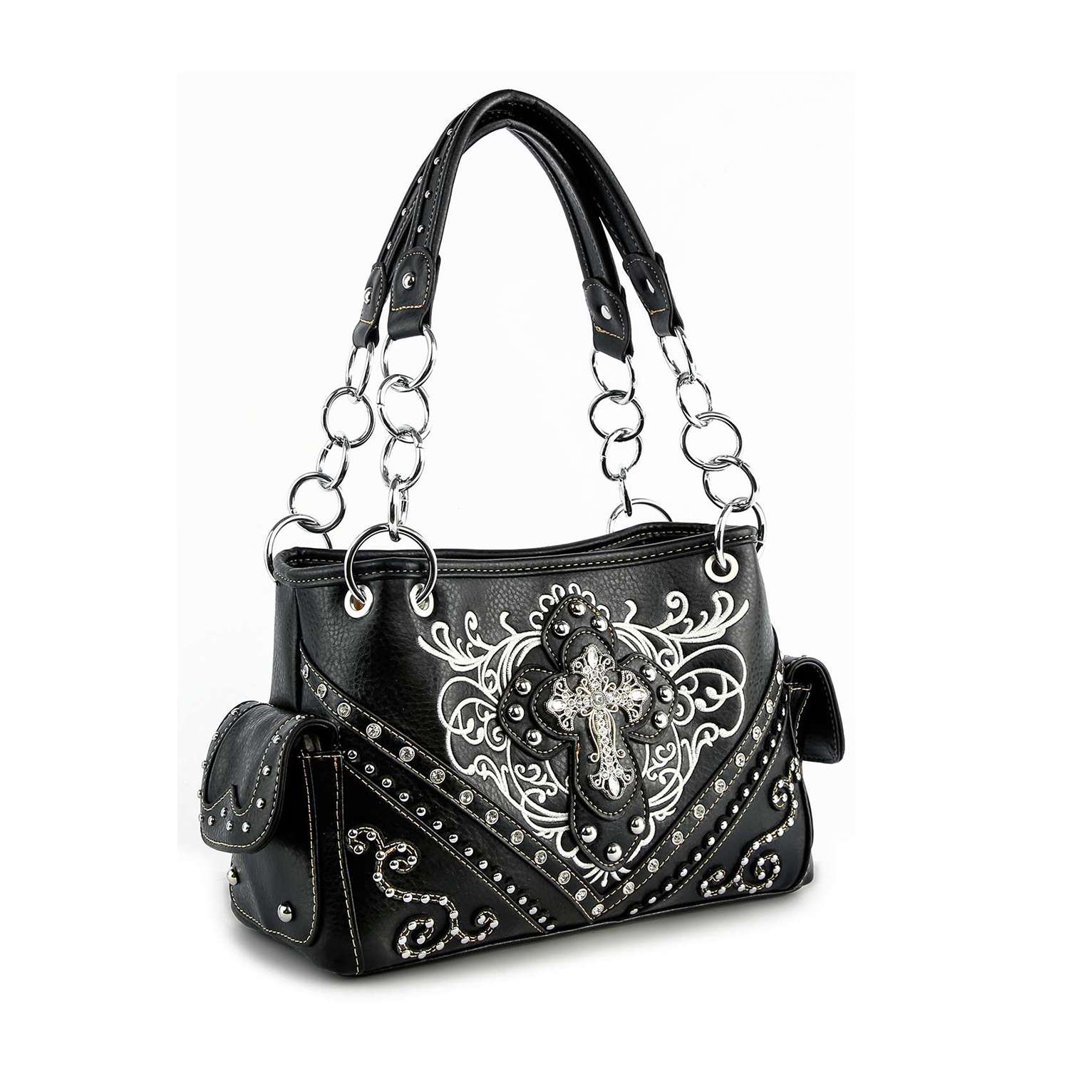 The Western Rhinestone Cross Handbag is a black faux leather purse with silver chain handles, white embroidery, decorative studs, side pockets, and a large ornate silver cross. This concealed carry bag boasts intricate detailing throughout.