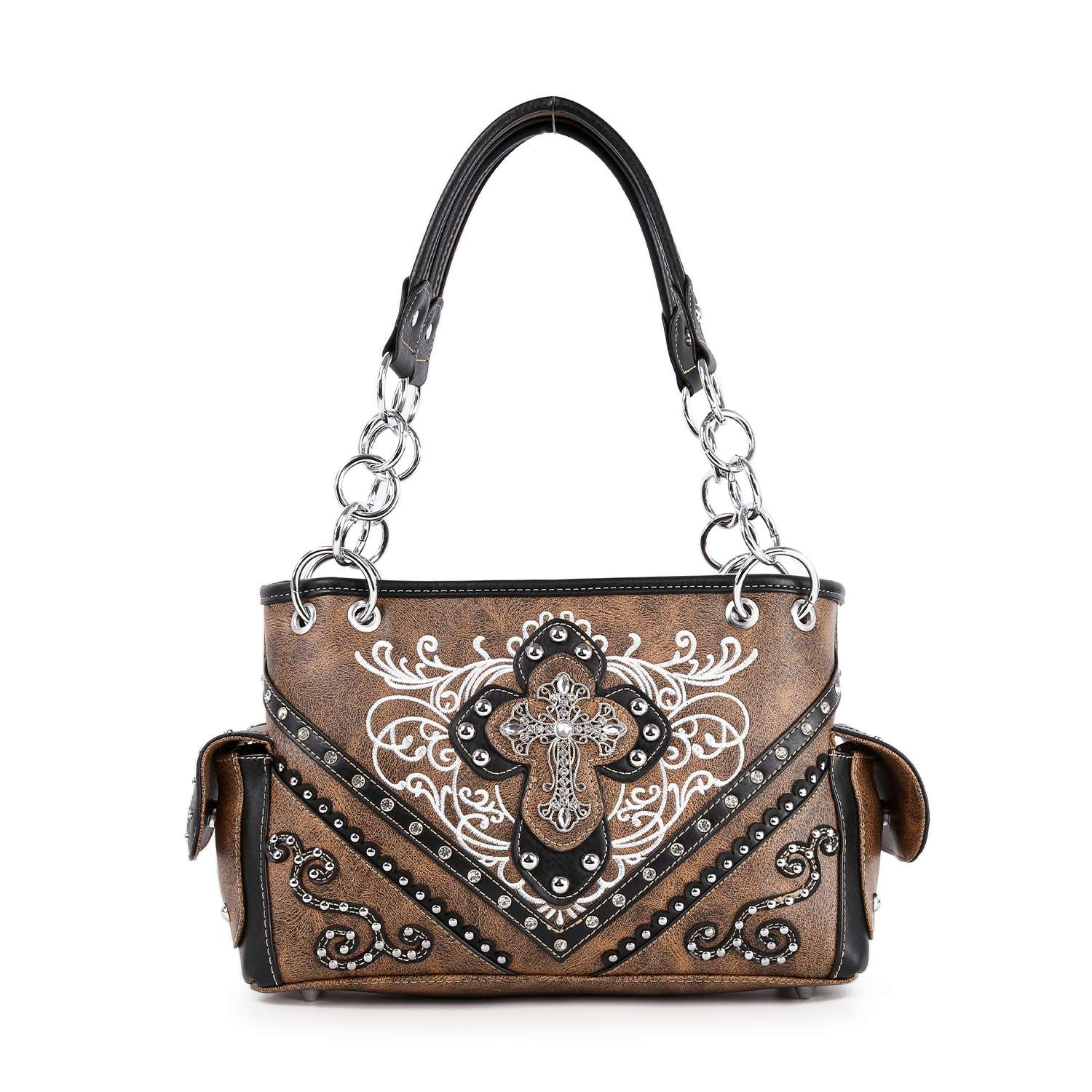 The Western Rhinestone Cross Handbag is a brown and black faux leather purse with silver chain handles, a large embroidered cross, white swirl accents, metal studs, and convenient side pockets.