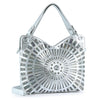 The Unique Rhinestone Design Handbag is a silver faux leather purse with two shoulder straps, featuring a circular radiating pattern of metallic studs and rhinestones for a sparkling, textured look.