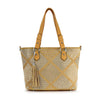 The Diamond Pattern Shopper Style Tote is a mustard yellow faux leather bag with double handles, silver studded diamond patterns, and a decorative tassel. Stylish and spacious, this structured tote easily fits a tablet—perfect for daily use.