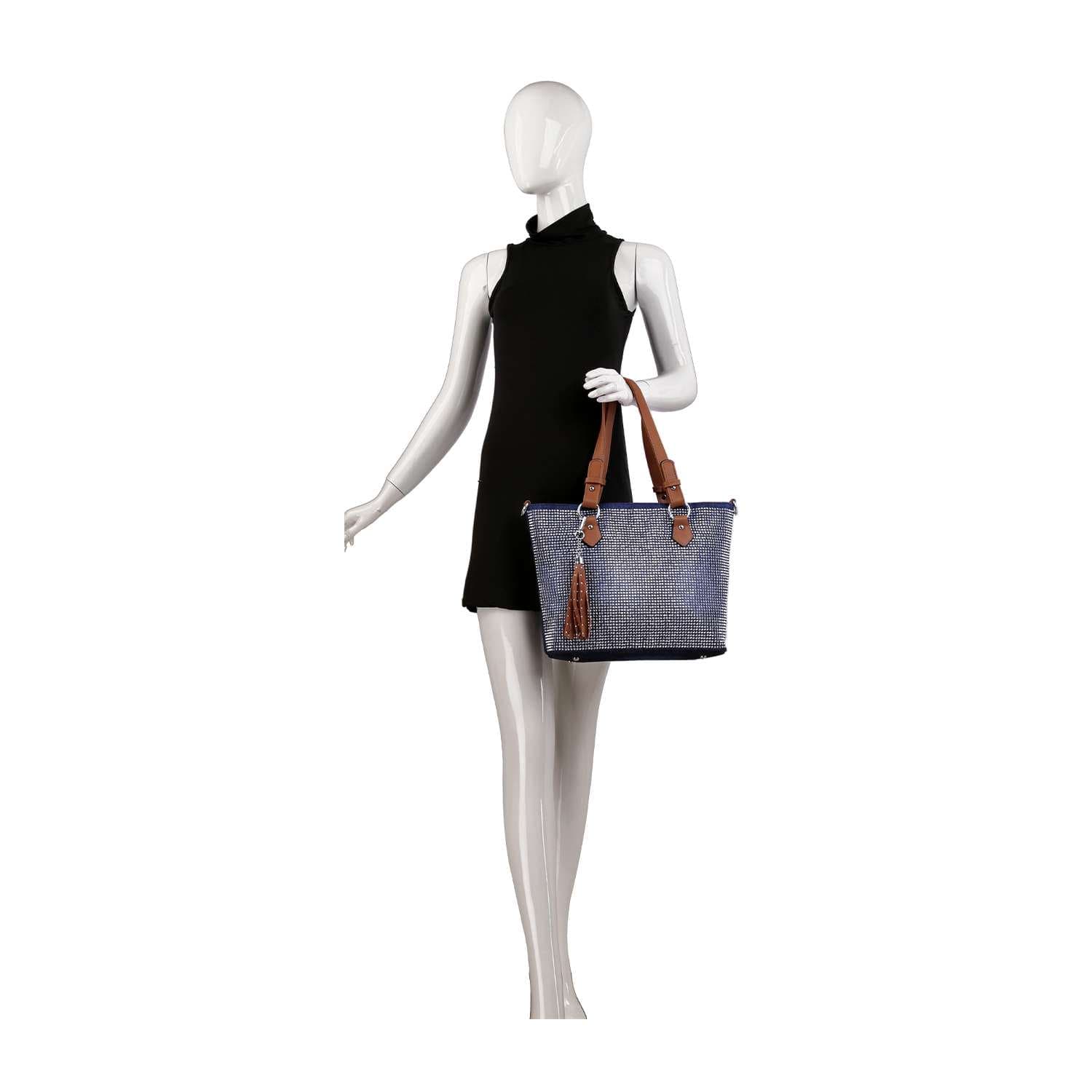 A mannequin in a sleeveless black dress holds the Rhinestone Denim Fashion Tote, featuring brown handles and a tassel, against a white background.