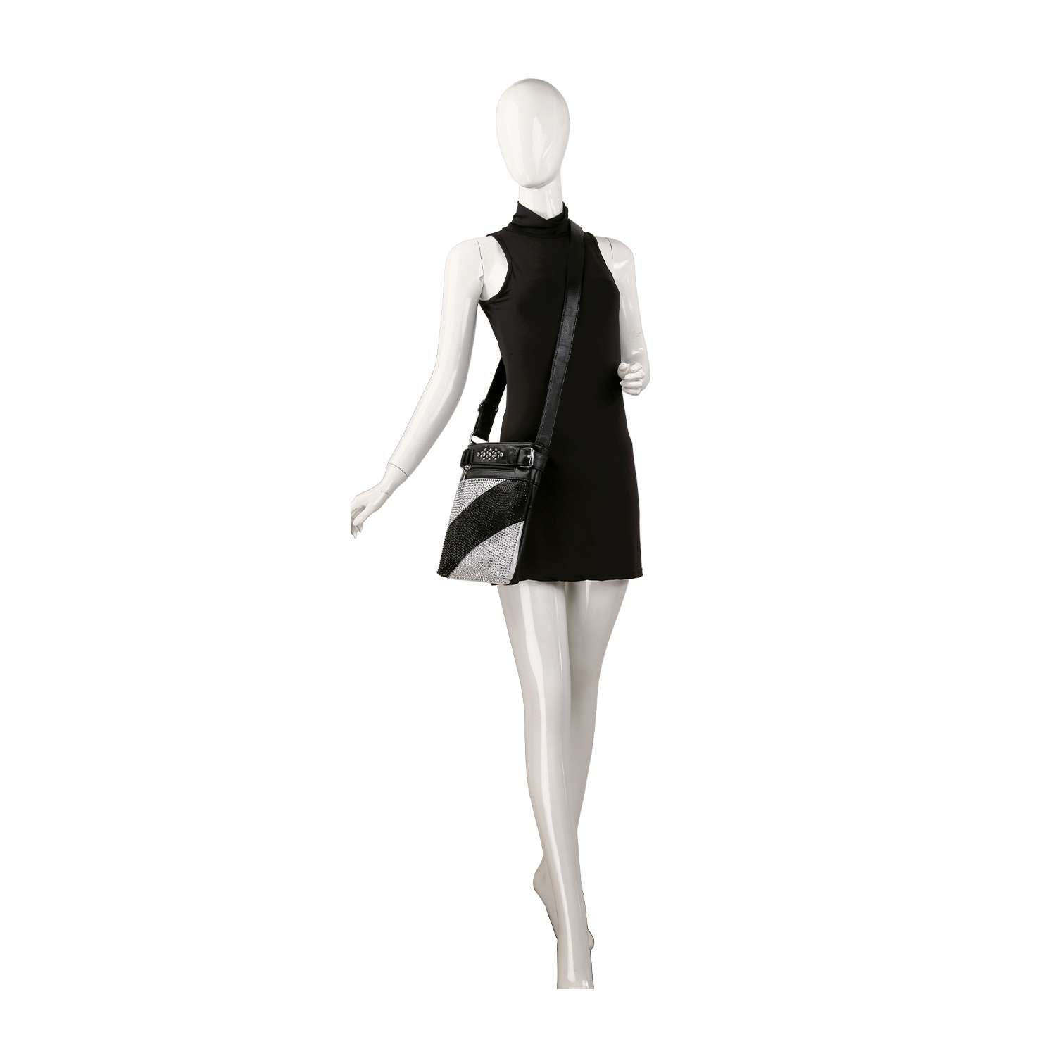 A mannequin wears a sleeveless black mini dress and the Bold Rhinestone Accent Crossbody Sling, featuring an adjustable strap and a black and silver geometric design, posed against a plain white background.
