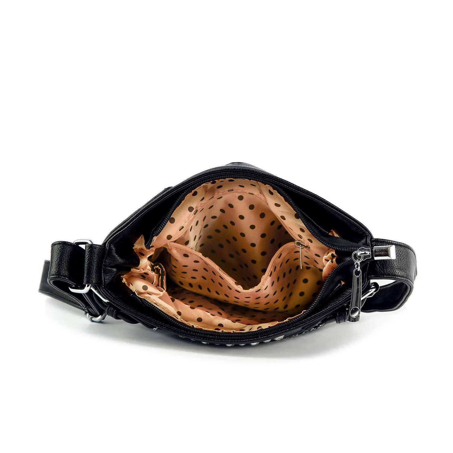 The Dazzling Skull Design Crossbody Sling features black faux leather, a top zipper, beige lining with dark polka dots, and multiple inner compartments.