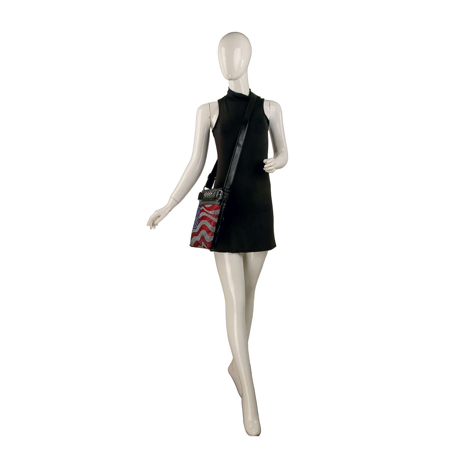 A mannequin in a sleeveless black mini dress poses with the Wavy Flag Rhinestone Design Crossbody, featuring red and white accents, against a plain white background.