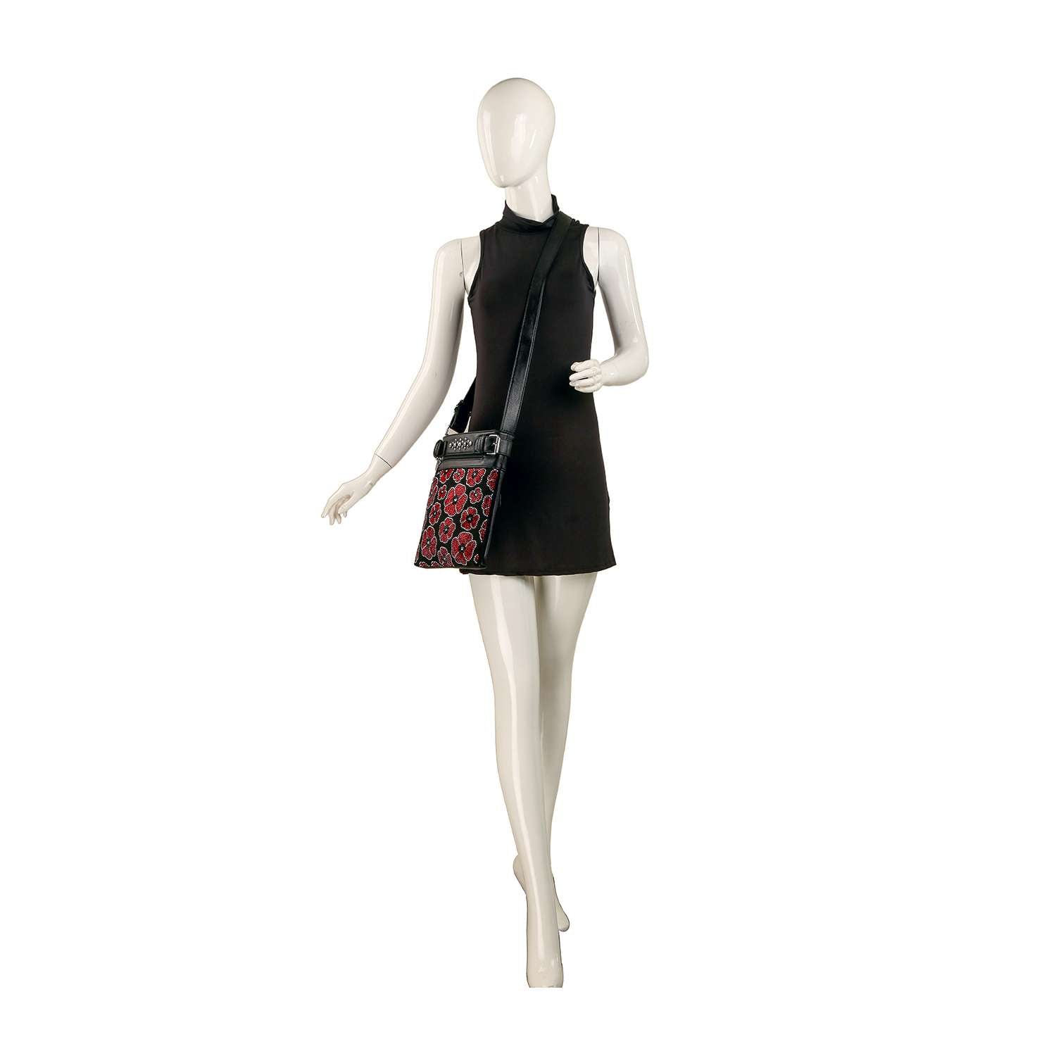A mannequin wears a sleeveless black mini dress with the Rhinestone Poppy Flowers Crossbody Bag, featuring bold red and black geometric patterns, styled as a crossbody purse against a white background.