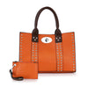 The Accessorized Twist-Lock Handbag is an orange faux leather bag with brown handles, silver vertical studs, and comes with a matching orange wristlet pouch featuring a zipper and wrist strap.