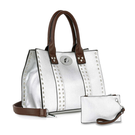 The Accessorized Twist-Lock Handbag features a silver faux leather design with brown handles and trim, an adjustable shoulder strap, top clasp closure, and comes with a matching silver wristlet.